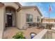 Charming front patio with outdoor seating and a view of the home's entrance with desert landscaping at 11123 E Olla Ave, Mesa, AZ 85212