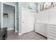 Hallway with light blue walls, a white closet, and white storage cabinet at 11123 E Olla Ave, Mesa, AZ 85212