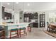 Bright kitchen featuring white countertops, stainless steel appliances, and dark brown cabinetry at 11123 E Olla Ave, Mesa, AZ 85212
