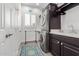 This laundry area features a stacked washer and dryer with counter space and ample storage at 11123 E Olla Ave, Mesa, AZ 85212