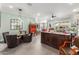 Open-concept living room with tiled floor, vintage buffet, and decorative furniture at 11123 E Olla Ave, Mesa, AZ 85212