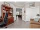 Home office featuring built-in bookcase, with an open view to living area at 11123 E Olla Ave, Mesa, AZ 85212