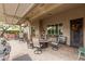 Inviting outdoor patio with a pergola, a built-in BBQ, and comfortable seating at 11123 E Olla Ave, Mesa, AZ 85212