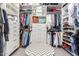 Bright walk-in closet with ample storage, shelving, and a stylish chevron patterned ottoman at 11123 E Olla Ave, Mesa, AZ 85212