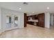 Open floor plan with a modern kitchen and breakfast bar, seamlessly blending into the adjacent living area at 11202 N 26Th Way, Phoenix, AZ 85028