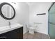 Accessible bathroom features modern fixtures, grab bars, and sleek vanity with round mirror at 11260 N 92Nd St # 1060, Scottsdale, AZ 85260