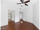 Bedroom features a ceiling fan, wood-style flooring, and an ensuite bathroom with shower at 11260 N 92Nd St # 1060, Scottsdale, AZ 85260