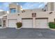 Exterior of condo building featuring multi-car garages and desert landscaping at 11260 N 92Nd St # 1060, Scottsdale, AZ 85260