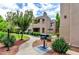 Exterior view of building with landscaped grounds and an outdoor grill at 11260 N 92Nd St # 1060, Scottsdale, AZ 85260