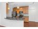 Kitchen with stainless steel appliances, wood cabinets, and black marble countertop at 11260 N 92Nd St # 1060, Scottsdale, AZ 85260