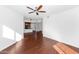 Spacious living room with wood floors and ceiling fan that leads into the kitchen at 11260 N 92Nd St # 1060, Scottsdale, AZ 85260