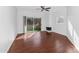 Bright living room with wood floors, ceiling fan, fireplace, and sliding doors to a balcony at 11260 N 92Nd St # 1060, Scottsdale, AZ 85260