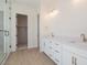 Bathroom showcases dual sinks, quartz countertops, and brass fixtures, providing a touch of luxury and functionality at 1254 E Penedes Dr, Gilbert, AZ 85298