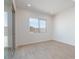 Bright, neutral bedroom with a large sliding glass door to the backyard at 1254 E Penedes Dr, Gilbert, AZ 85298