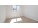 Bedroom with window, neutral walls and light wood look floors at 1254 E Penedes Dr, Gilbert, AZ 85298