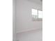 Bright bedroom features a large window and neutral carpeting, offering a serene and comfortable living space at 1254 E Penedes Dr, Gilbert, AZ 85298