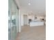 Open-concept kitchen with white cabinets, center island, and stainless steel appliances at 1254 E Penedes Dr, Gilbert, AZ 85298