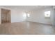Spacious living room with lots of natural light, neutral walls, and wood look floors at 1254 E Penedes Dr, Gilbert, AZ 85298