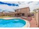 Spacious backyard features a refreshing swimming pool and a covered patio, ideal for relaxation and entertaining at 12574 W Desert Rose Rd, Avondale, AZ 85392