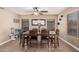 Inviting dining room features a ceiling fan and a large mirror, creating an ideal space for Gathering meals and entertaining at 12574 W Desert Rose Rd, Avondale, AZ 85392