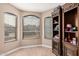 Office with built-in shelving, natural light from the window, and neutral paint at 12574 W Desert Rose Rd, Avondale, AZ 85392