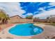 Beautiful backyard pool with a modern design, surrounded by mature landscaping, perfect for summer fun at 12574 W Desert Rose Rd, Avondale, AZ 85392