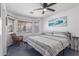 Bright bedroom with blue floor, lots of natural light, and ceiling fan at 12630 W Aster Dr, El Mirage, AZ 85335