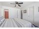 Bedroom with a ceiling fan and ensuite bathroom at 12630 W Aster Dr, El Mirage, AZ 85335