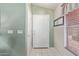 Clean entryway featuring neutral-toned walls, a window, and a white front door providing a welcoming entrance at 12630 W Aster Dr, El Mirage, AZ 85335