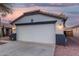Spacious two-car garage with modern lighting and a security system for added peace of mind at 12630 W Aster Dr, El Mirage, AZ 85335