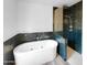 Modern bathroom featuring soaking tub and walk-in shower with beautiful tile surround at 1321 E Pedro Rd, Phoenix, AZ 85042