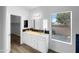 Bathroom featuring double vanity with glass vessel sinks and a window view at 1321 E Pedro Rd, Phoenix, AZ 85042