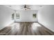 Bright main bedroom offering generous space, neutral decor, modern lighting, and views of the outdoor landscape at 1321 E Pedro Rd, Phoenix, AZ 85042