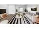 Bright living room showcasing contemporary decor, neutral palette, wood-look floors, and lots of natural light at 1321 E Pedro Rd, Phoenix, AZ 85042