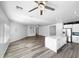 Bright living room with modern flooring, recessed lighting, and view to the kitchen at 1321 E Pedro Rd, Phoenix, AZ 85042