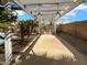 Outdoor kitchen and pergola with ceiling fans for backyard entertainment at 1321 E Pedro Rd, Phoenix, AZ 85042