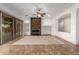 Living room featuring a stone fireplace, recessed lighting, and sliding glass doors for natural light at 13344 W Via Caballo Blanco --, Peoria, AZ 85383