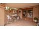 Cozy back patio with a table, chairs, and tiled flooring at 1365 N El Dorado Dr, Chandler, AZ 85224