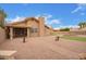 Backyard patio with landscaped yard and manicured putting green at 1365 N El Dorado Dr, Chandler, AZ 85224