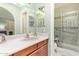 Bathroom with a single sink vanity and a walk-in shower at 1365 N El Dorado Dr, Chandler, AZ 85224