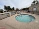 Relaxing community hot tub with fencing next to a community pool at 1365 N El Dorado Dr, Chandler, AZ 85224