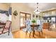 Dining area featuring wood floors, a chandelier, and seating for four at 1365 N El Dorado Dr, Chandler, AZ 85224
