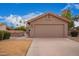 Charming single-story home featuring a two-car garage, desert landscaping, and a terracotta-tiled roof at 1365 N El Dorado Dr, Chandler, AZ 85224