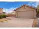 Charming single-story home featuring a two-car garage, desert landscaping, and a terracotta-tiled roof at 1365 N El Dorado Dr, Chandler, AZ 85224