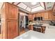Modern kitchen featuring stainless steel appliances, wood cabinets, and stone countertops at 1365 N El Dorado Dr, Chandler, AZ 85224