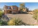 A large, enclosed backyard with a low maintenance xeriscaped yard at 13672 W Chaparosa Way, Peoria, AZ 85383