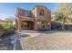 Two-story home featuring a low maintenance xeriscaped backyard and covered patio at 13672 W Chaparosa Way, Peoria, AZ 85383