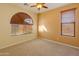 A bedroom with carpet, neutral walls, window with blinds, and a ceiling fan at 13672 W Chaparosa Way, Peoria, AZ 85383