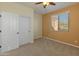 Bedroom featuring carpet, neutral walls, large closet and a window with blinds at 13672 W Chaparosa Way, Peoria, AZ 85383