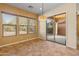 Bright dining area features a modern light fixture and a sliding door leading to the outdoor patio at 13672 W Chaparosa Way, Peoria, AZ 85383